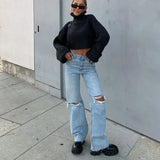 Novos jeans de perna reta rasgados e lavados. Novos jeans micro-acampanados casuais elegantes e versáteis para mulheres na primavera e no verão